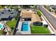 Backyard featuring pool and patio, manicured lawn and landscaping on a residential neighborhood street at 4202 E Catalina Dr, Phoenix, AZ 85018
