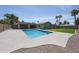 A backyard and pool feature a patio area and artificial turf for low maintenance and enjoyable outdoor living at 4202 E Catalina Dr, Phoenix, AZ 85018