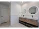 Contemporary bathroom featuring a dual-sink vanity, and white subway tile backsplash at 4202 E Catalina Dr, Phoenix, AZ 85018