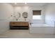 Modern bathroom with double vanity, sleek fixtures and a separate soaking tub at 4202 E Catalina Dr, Phoenix, AZ 85018