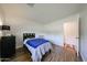 Bedroom featuring wood floors, large window, and closet at 4202 E Catalina Dr, Phoenix, AZ 85018