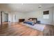 Spacious bedroom with hardwood floors, neutral walls, and a cozy bed at 4202 E Catalina Dr, Phoenix, AZ 85018