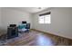 Bright room with hardwood floors and a large window creating a welcoming space to work or relax at 4202 E Catalina Dr, Phoenix, AZ 85018