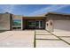 Modern home featuring a walkway with grass accents, a large front window, and desert landscaping at 4202 E Catalina Dr, Phoenix, AZ 85018