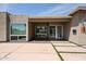 Modern home featuring a walkway with grass accents, a large front window, and desert landscaping at 4202 E Catalina Dr, Phoenix, AZ 85018