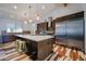 Bright kitchen features a large island with a breakfast bar, stainless steel appliances, and modern cabinets at 4202 E Catalina Dr, Phoenix, AZ 85018
