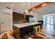 Bright kitchen features a large island with a breakfast bar, stainless steel appliances, and modern cabinets at 4202 E Catalina Dr, Phoenix, AZ 85018