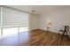 Inviting living room with hardwood floors and a well-lit window at 4202 E Catalina Dr, Phoenix, AZ 85018