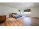 Expansive main bedroom with hardwood floors, abundant natural light, and a serene atmosphere for ultimate relaxation at 4202 E Catalina Dr, Phoenix, AZ 85018
