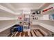 Spacious pantry with ample shelving for organized storage, ideal for keeping all your kitchen essentials in order at 4202 E Catalina Dr, Phoenix, AZ 85018