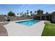 Backyard in-ground swimming pool with adjacent artificial turf, patio and charcoal grill at 4202 E Catalina Dr, Phoenix, AZ 85018