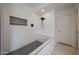 Walk-in shower with black fixtures, subway tile and a built-in shower bench at 4202 E Catalina Dr, Phoenix, AZ 85018