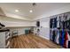 Large walk-in closet featuring built-in shelving and hardwood style floors at 4202 E Catalina Dr, Phoenix, AZ 85018