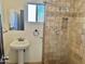 Bathroom with tile shower, vanity, and mirror creates a functional and stylish space at 4213 N Westview Dr, Phoenix, AZ 85015