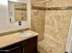 Bathroom with tiled shower and vanity is perfect for relaxation and functionality at 4213 N Westview Dr, Phoenix, AZ 85015