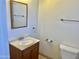 Bathroom featuring a vanity, a square mirror, and neutral finishes in the fixtures and flooring at 4213 N Westview Dr, Phoenix, AZ 85015