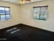 Cozy bedroom featuring two windows with blinds and neutral carpet for comfortable living at 4213 N Westview Dr, Phoenix, AZ 85015