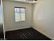 Bedroom with single window, neutral carpet, and fresh paint creates a blank canvas at 4213 N Westview Dr, Phoenix, AZ 85015