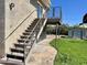 Exterior stairs leading to a balcony overlooking the landscaped backyard and a convenient storage shed at 4213 N Westview Dr, Phoenix, AZ 85015