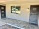 Covered front porch with tiled flooring and a secure steel door at 4213 N Westview Dr, Phoenix, AZ 85015