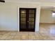 Living room with tiled floor and view of dining room at 4213 N Westview Dr, Phoenix, AZ 85015