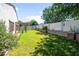 Lush backyard with mature trees and a patio area, perfect for outdoor living at 4455 E Marshall Ave, Gilbert, AZ 85297