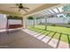 Cozy covered patio with swing offers a relaxing view of the backyard at 4455 E Marshall Ave, Gilbert, AZ 85297