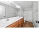 Bathroom boasts double sinks, wood cabinets and a shower over tub at 4455 E Marshall Ave, Gilbert, AZ 85297