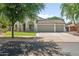 Charming single-story home with a three-car garage and a well-maintained front yard at 4455 E Marshall Ave, Gilbert, AZ 85297
