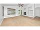 Spacious living room featuring a ceiling fan, fireplace, and neutral paint at 4455 E Marshall Ave, Gilbert, AZ 85297