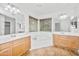 Bright main bathroom features dual sinks, a soaking tub, and plenty of natural light, creating a spa-like experience at 4455 E Marshall Ave, Gilbert, AZ 85297