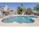 Backyard pool with a slide and mature landscaping, perfect for outdoor fun at 4627 E Mcneil St, Phoenix, AZ 85044