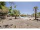 Spacious backyard showing pool, mature trees, and a well-defined boundary at 4627 E Mcneil St, Phoenix, AZ 85044