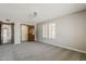 Large bedroom features a closet, large window with shutters, and ceiling fan at 4627 E Mcneil St, Phoenix, AZ 85044