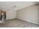 Spacious bedroom featuring gray laminate flooring and neutral paint color at 4627 E Mcneil St, Phoenix, AZ 85044