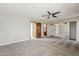 A spacious bedroom boasts neutral colors, carpeted floors, ceiling fan and mirrored closet doors at 4627 E Mcneil St, Phoenix, AZ 85044