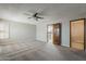 This bedroom features neutral colors, carpeted floors, ceiling fan and shutters on the windows at 4627 E Mcneil St, Phoenix, AZ 85044