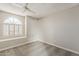 This bedroom boasts a large, shuttered window that streams natural light at 4627 E Mcneil St, Phoenix, AZ 85044