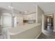Bright kitchen includes a white refrigerator, cabinets, stove, and breakfast bar with seating at 4627 E Mcneil St, Phoenix, AZ 85044