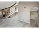 Open-concept living room with stairs, bright flooring, and plenty of natural light at 4627 E Mcneil St, Phoenix, AZ 85044