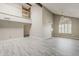 Bright, open-concept living room featuring high ceilings, stylish flooring and a fan window at 4627 E Mcneil St, Phoenix, AZ 85044