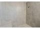 This updated shower is tiled with a bench and modern fixtures at 4627 E Mcneil St, Phoenix, AZ 85044