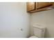 This bathroom features wood cabinets above the toilet at 4627 E Mcneil St, Phoenix, AZ 85044