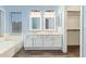 Charming bathroom featuring double vanity sinks, ample storage, and stylish finishes at 4911 E Holmes Ave, Mesa, AZ 85206