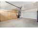 Large garage with built-in cabinets and storage, offering parking and space for projects at 4911 E Holmes Ave, Mesa, AZ 85206