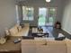 Bright living room with plush couches, modern decor, and sliding glass doors that lead to a landscaped yard at 4911 E Holmes Ave, Mesa, AZ 85206