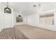 Inviting living room with neutral carpet, tile accents, light fixtures, and lots of natural light at 4911 E Holmes Ave, Mesa, AZ 85206