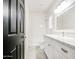 Bright bathroom featuring a white dual sink vanity, modern fixtures, and a full shower at 5230 E Pony Track Ln, San Tan Valley, AZ 85140
