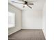 Bright bedroom featuring soft carpet and a ceiling fan, perfect for relaxation and comfort at 5230 E Pony Track Ln, San Tan Valley, AZ 85140