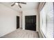 Well-lit bedroom with closet and window, offering a blend of space and comfort at 5230 E Pony Track Ln, San Tan Valley, AZ 85140